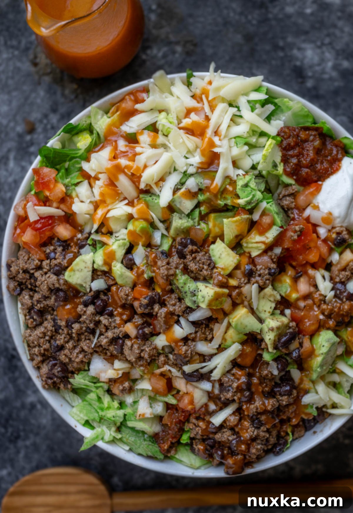 zoomed in image of taco salad with homemade Catalina Dressing and all the taco toppings 