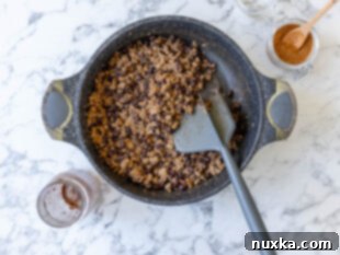 canned beans added to the browned beef with taco seasoning