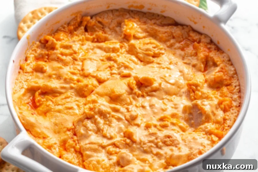 Delicious Buffalo Chicken Dip recipe ready to be served with chips and celery sticks