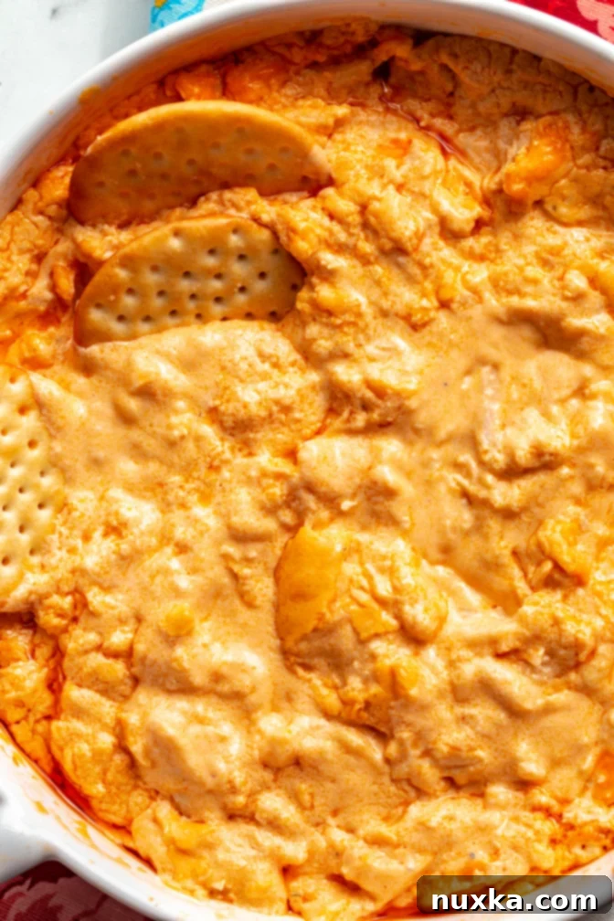 Up-close image of creamy Buffalo Chicken Dip in a baking dish, perfect for sharing