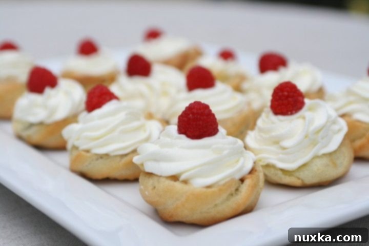 Delicious Cream Puff Baskets filled with dulce de leche and raspberries