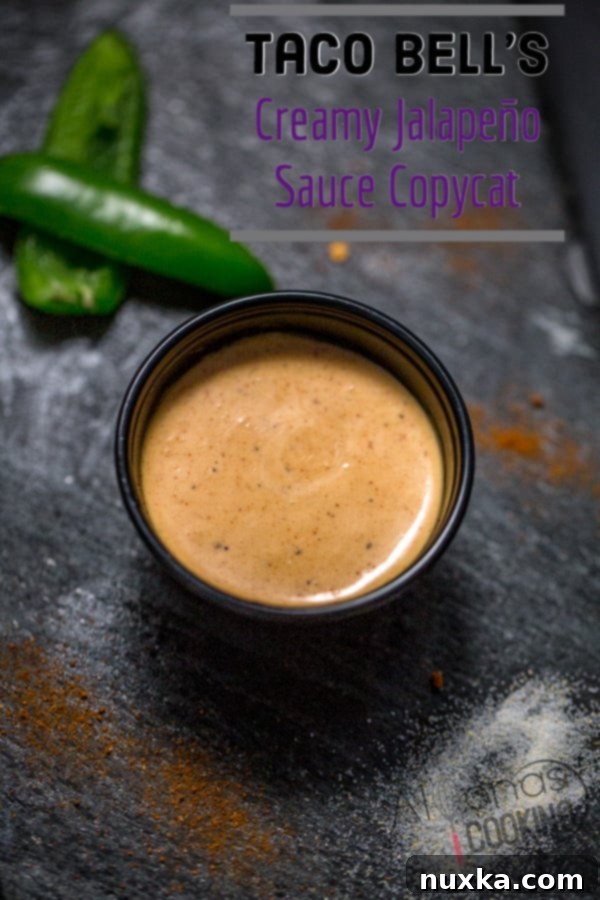 Taco Bell quesadilla sauce in a squeeze bottle, ready for use or storage. Perfect for pinning!