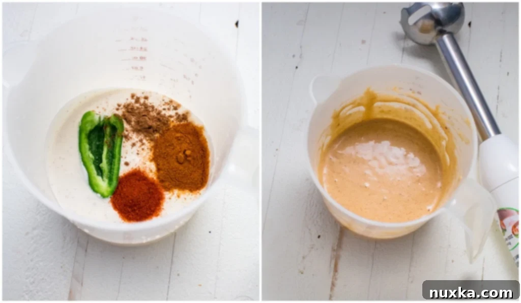 A hand blender mixing ingredients for Taco Bell quesadilla sauce in a measuring cup.