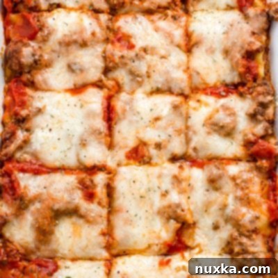A classic homemade lasagna casserole with a golden, bubbly cheese top, ready to be served.