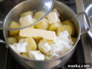 How to steam potatoes in butter, sour cream, and cream cheese for creamy mashed potatoes