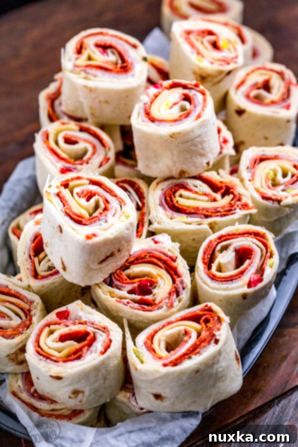 Close-up of freshly sliced Italian Pinwheels on a cutting board