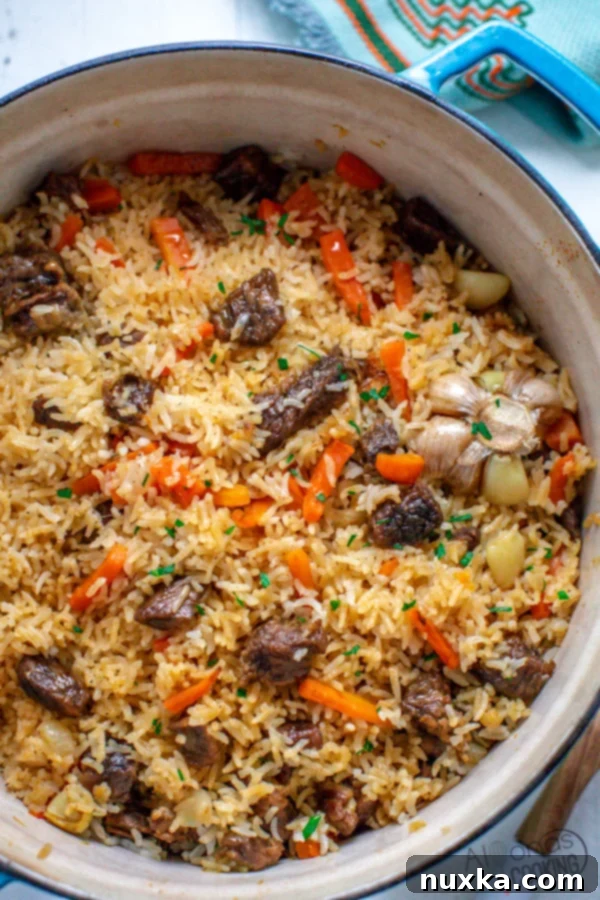 Ukrainian Beef Plov, a savory rice pilaf with meat, rice, and vegetables