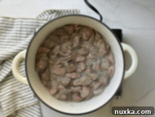 Step 1: Searing beef chunks in a Dutch oven for Beef Plov.