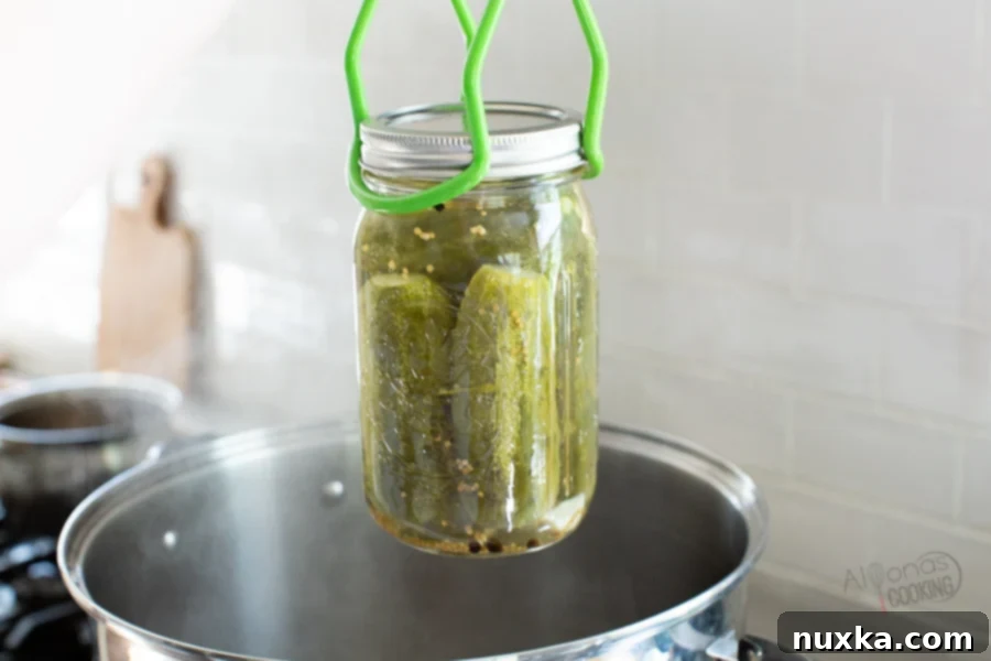 canned pickles removed from a water bath 