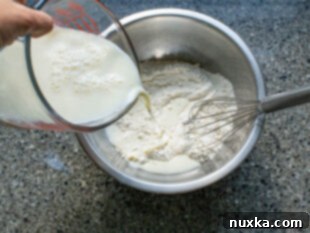 How to make a smooth savory crepe batter by whisking ingredients.