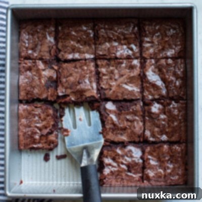 Homemade boxed brownie recipe with glossy top and fudgy interior.