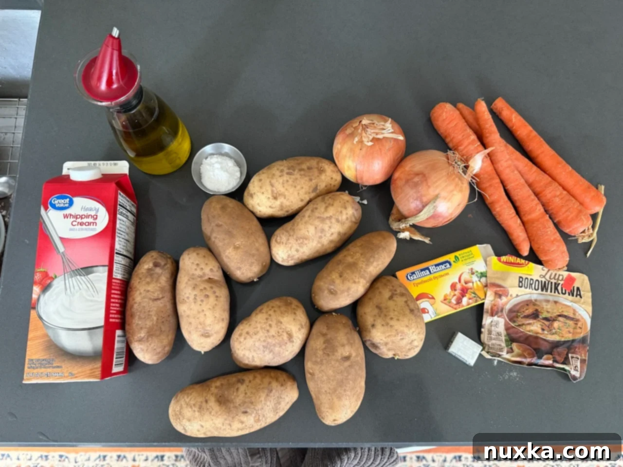 Cream-Infused Baked Potato Wedges 5 image of creamy potato wedges ingredients including russet potatoes, carrots, onions, mushroom bouillon, and heavy cream