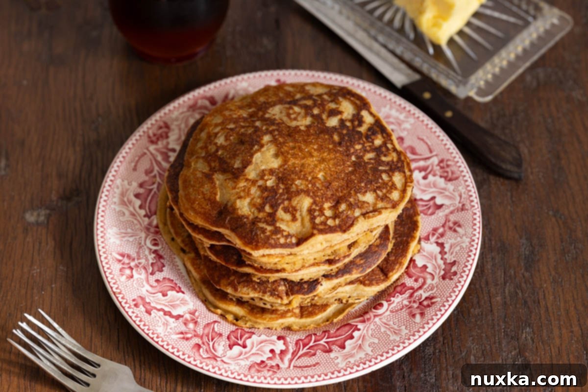 whole grain einkorn pancakes on a red vintage plate 