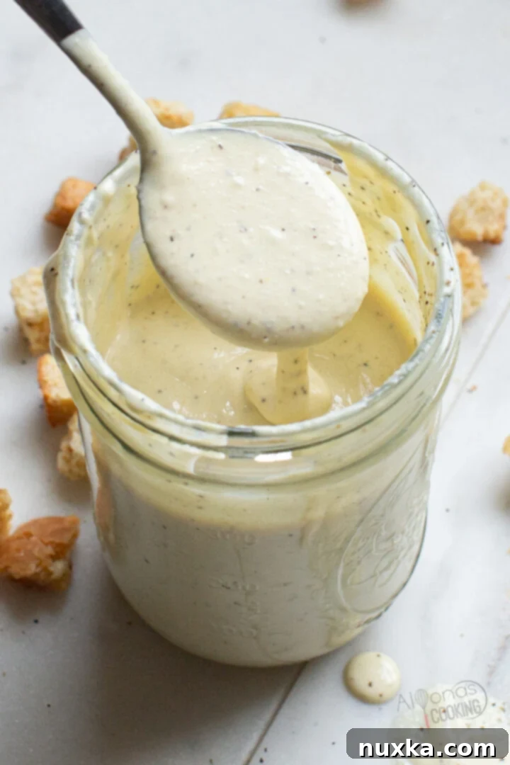 A close-up image of a jar of freshly made homemade mayonnaise.