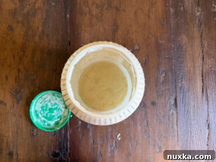 Effortless Everyday Sourdough 4 Large plastic container used for storing sourdough starter, illustrating its durability