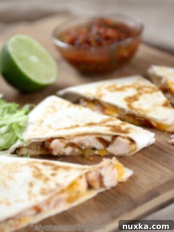 Delicious and super easy homemade chicken quesadillas with melted cheese