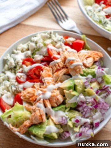 Spicy shredded buffalo chicken salad in a bowl