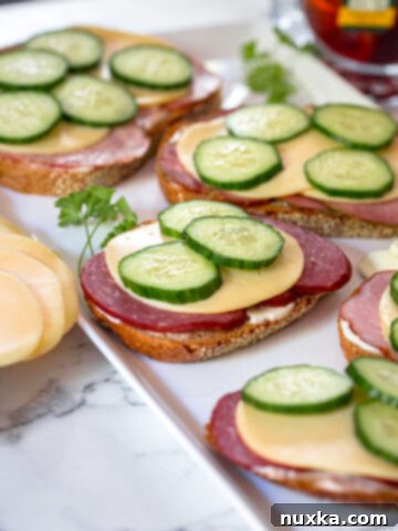 Russian tea sandwiches with kielbasa, cheese and cucumbers on Lithuanian bread
