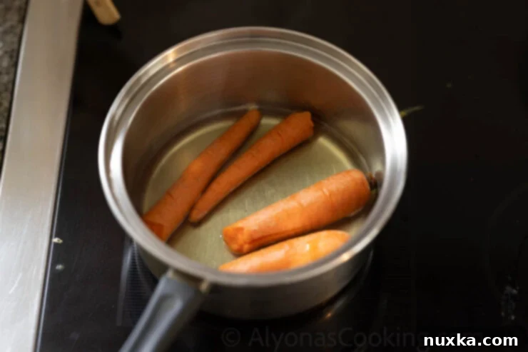 image of boiled carrots in a saucepan for carrot sandwiches