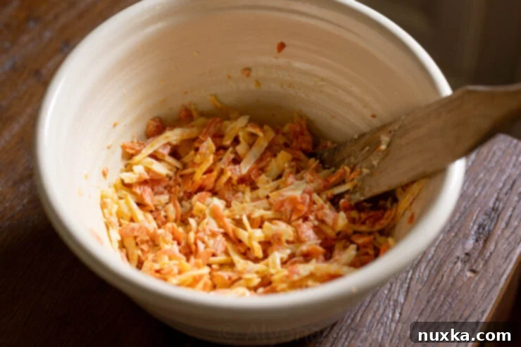 image of grated carrots and other sandwich filling ingredients, ready to be topped over bread and baked