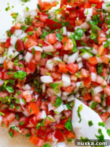 pico de gallo in a glass bowl