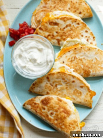 breakfast quesadillas on a blue plate