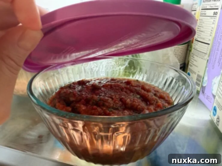 Image of homemade salsa stored in the fridge.