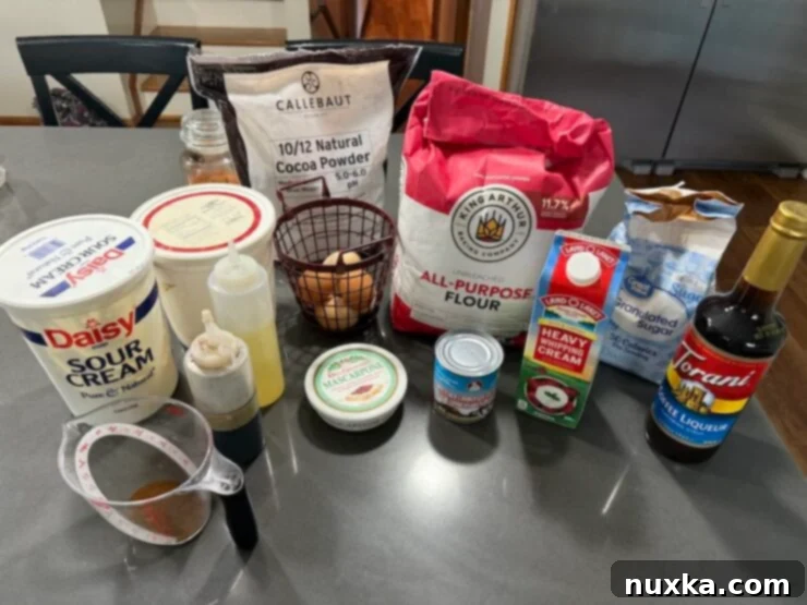 All the tiramisu cake ingredients (for sponge layers, coffee syrup, and cocoa cream frosting).