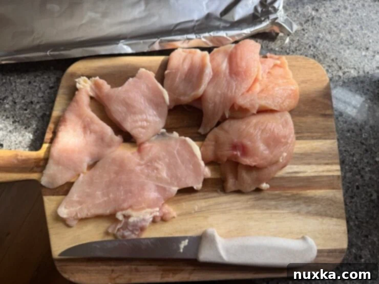 image of cut chicken breast for sheet pan Italian chicken
